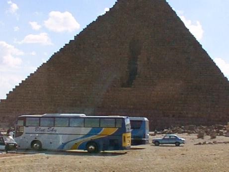 Menkaure's Pyramid (note the granite casing stones behind the inconveniently-parked coaches!)